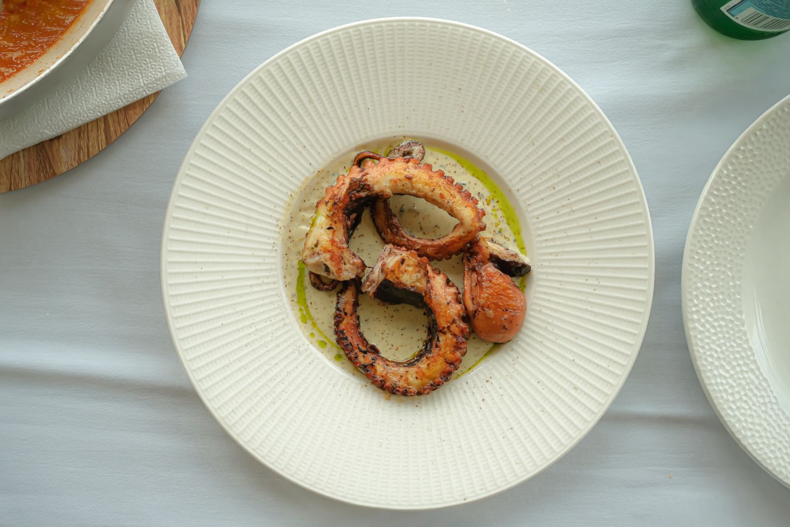 Grilled octopus, photographed from above.
